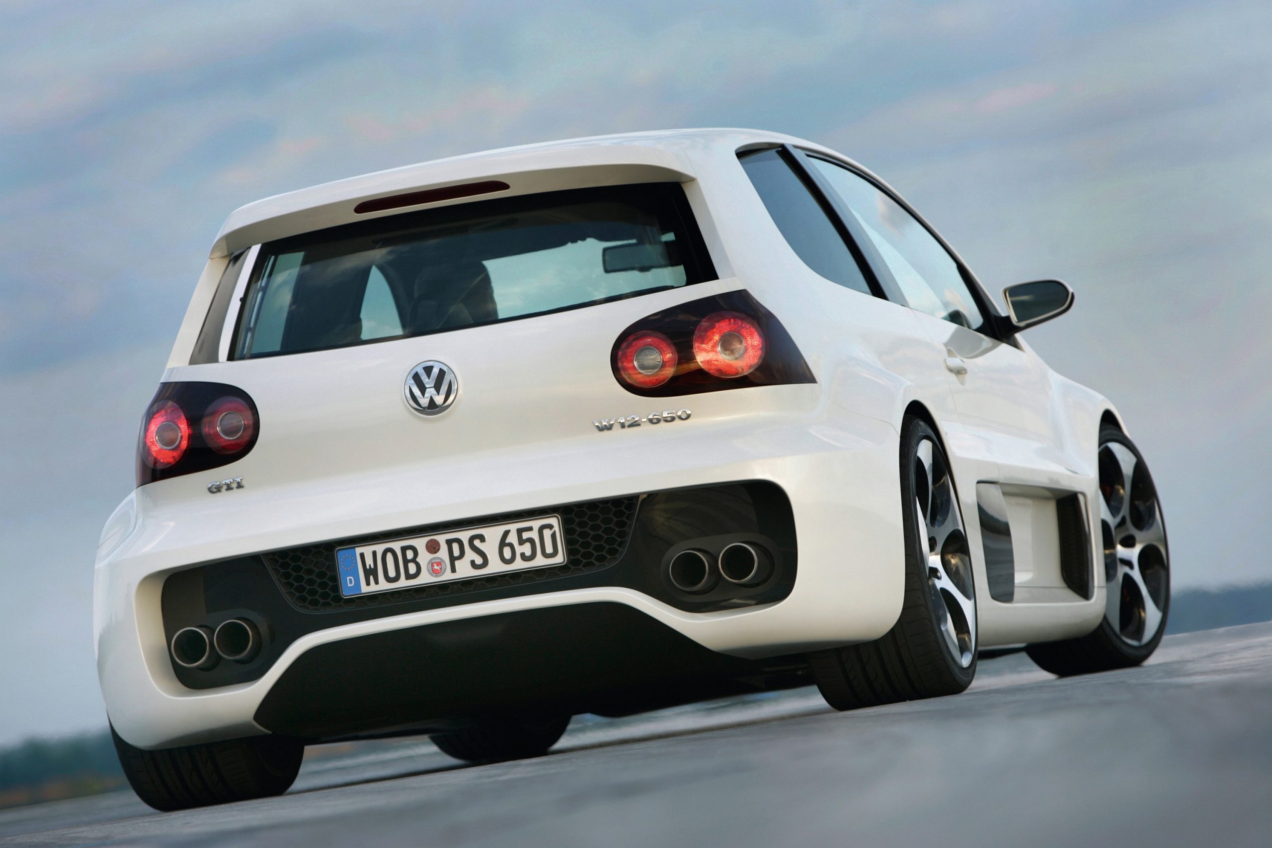 A rear 3/4 shot of a Volkswagen GTI hot hatch with a Bentley engine