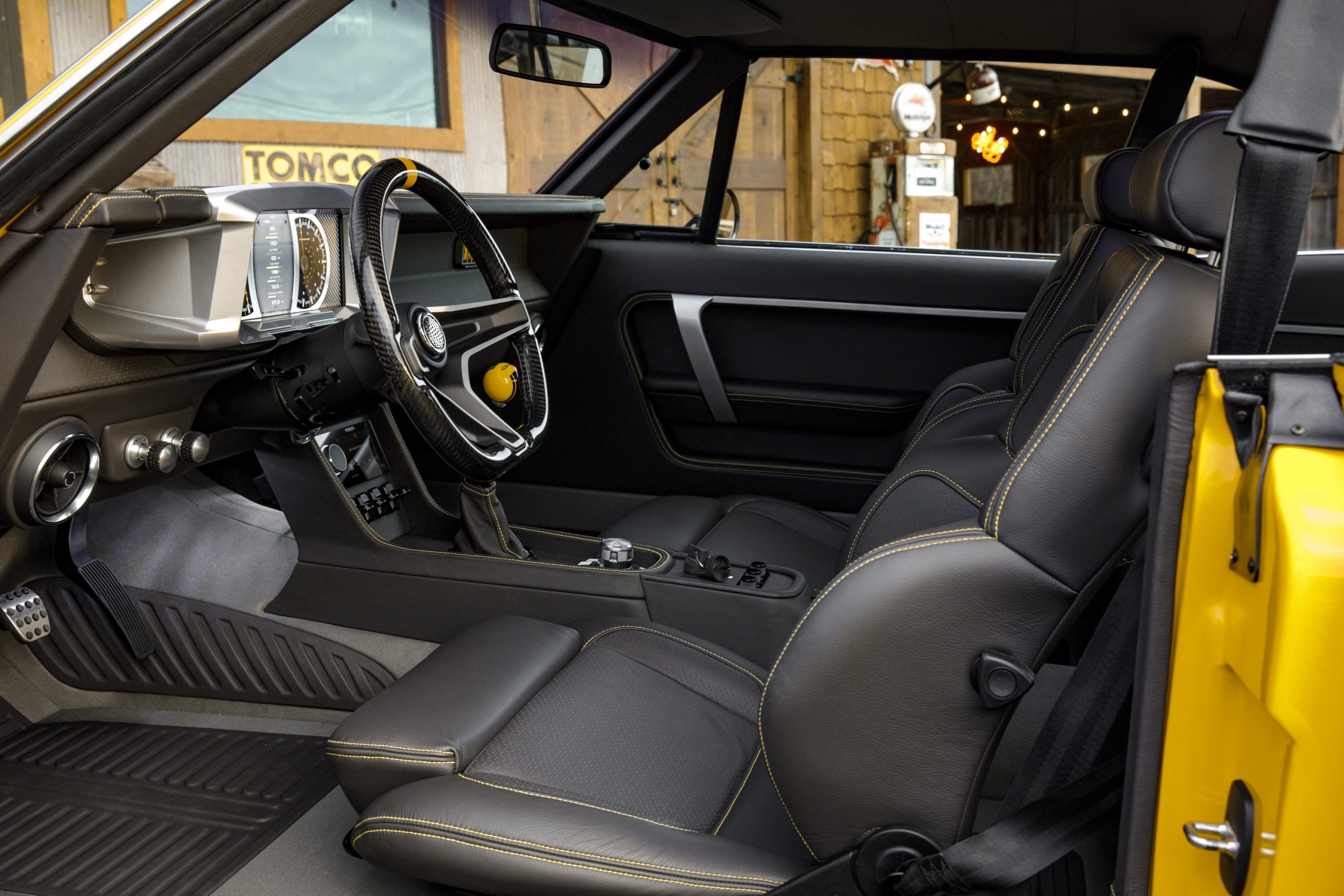 The interior of the RingBrothers 1969 Dodge Charger with a manual transmission