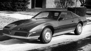 A 1982 Pontiac Firebird parked on a street in December 1981