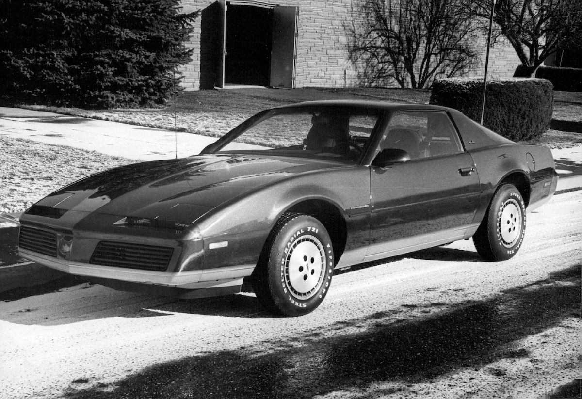 A 1982 Pontiac Firebird parked on a street in December 1981