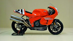 An orange-and-black 1994 Harley-Davidson VR1000 track bike on a rear-wheel stand