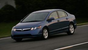 A blue 8th generation Honda Civic sedan shot from the front 3/4