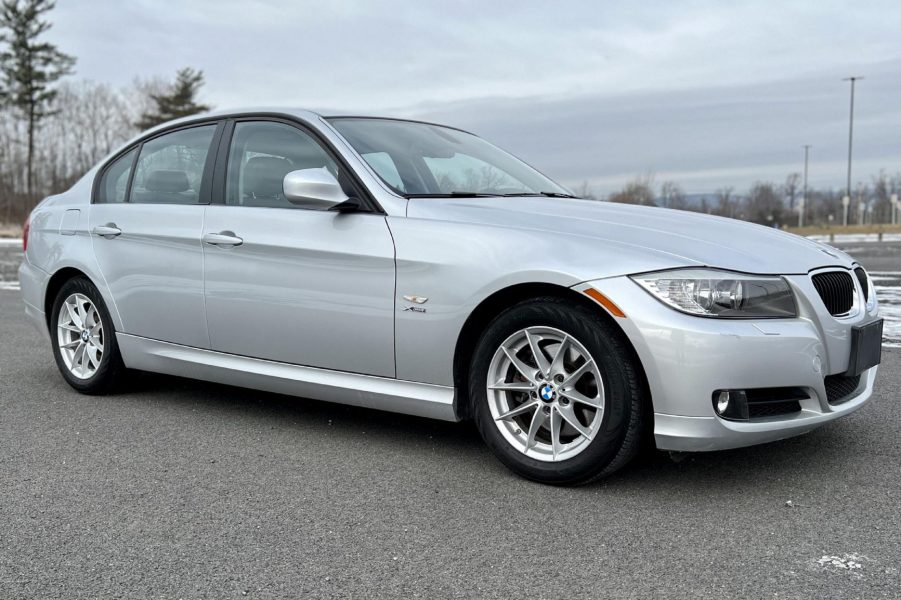 A silver 2010 BMW 328i xDrive sedan in a parking lot