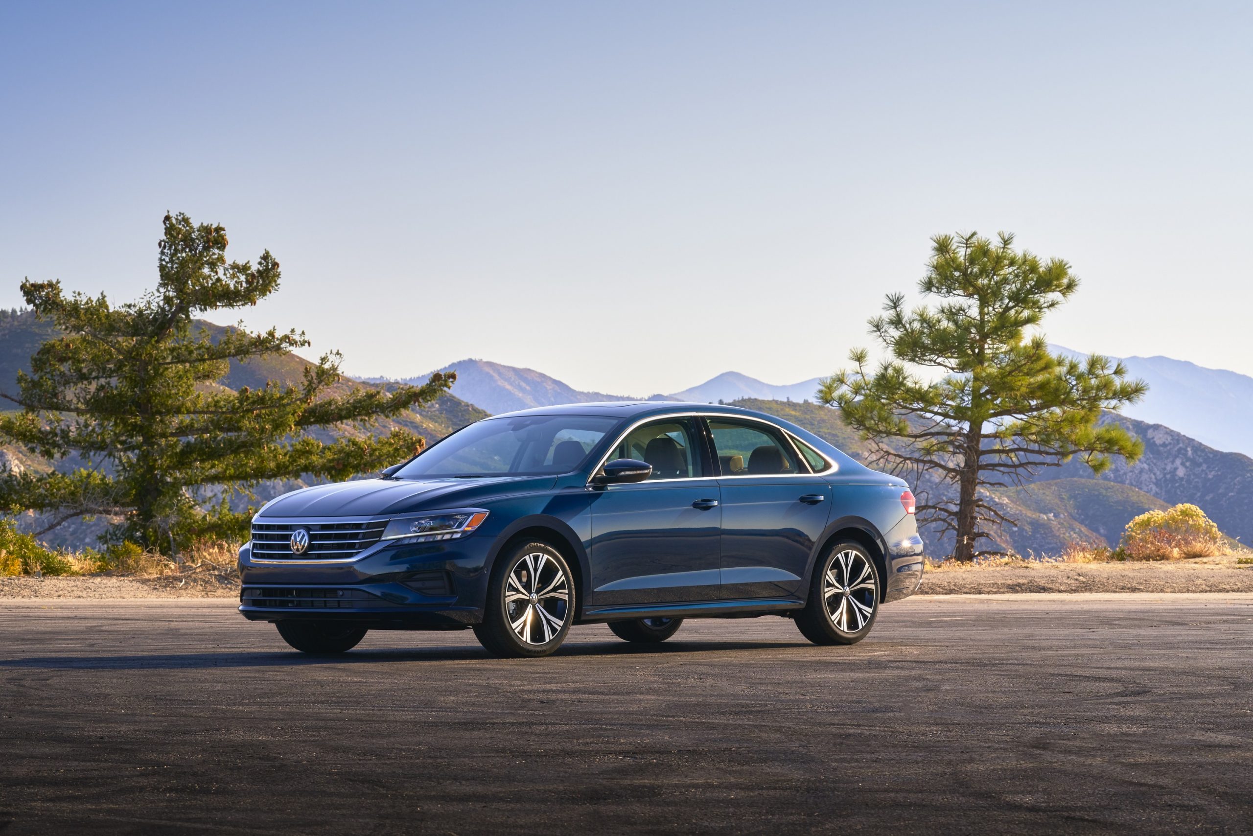 A Volkswagen Passat sedan is a great cheap used car, shot here from the front 3/4 at sunset