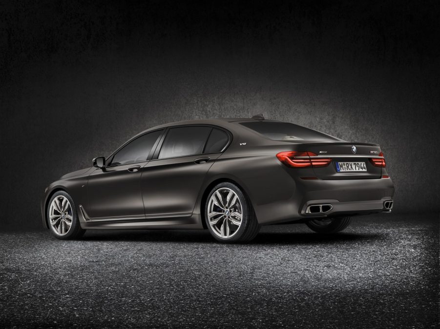 The rear 3/4 view of a dark-gray 2022 BMW M760i xDrive