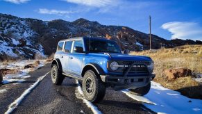 A blue 2022 Ford Bronco off-road SUV shot from the front 3/4