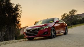 A red 2022 Honda Accord shot at sunset