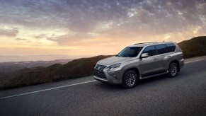 A silver 2022 Lexus GX SUV on a hill road