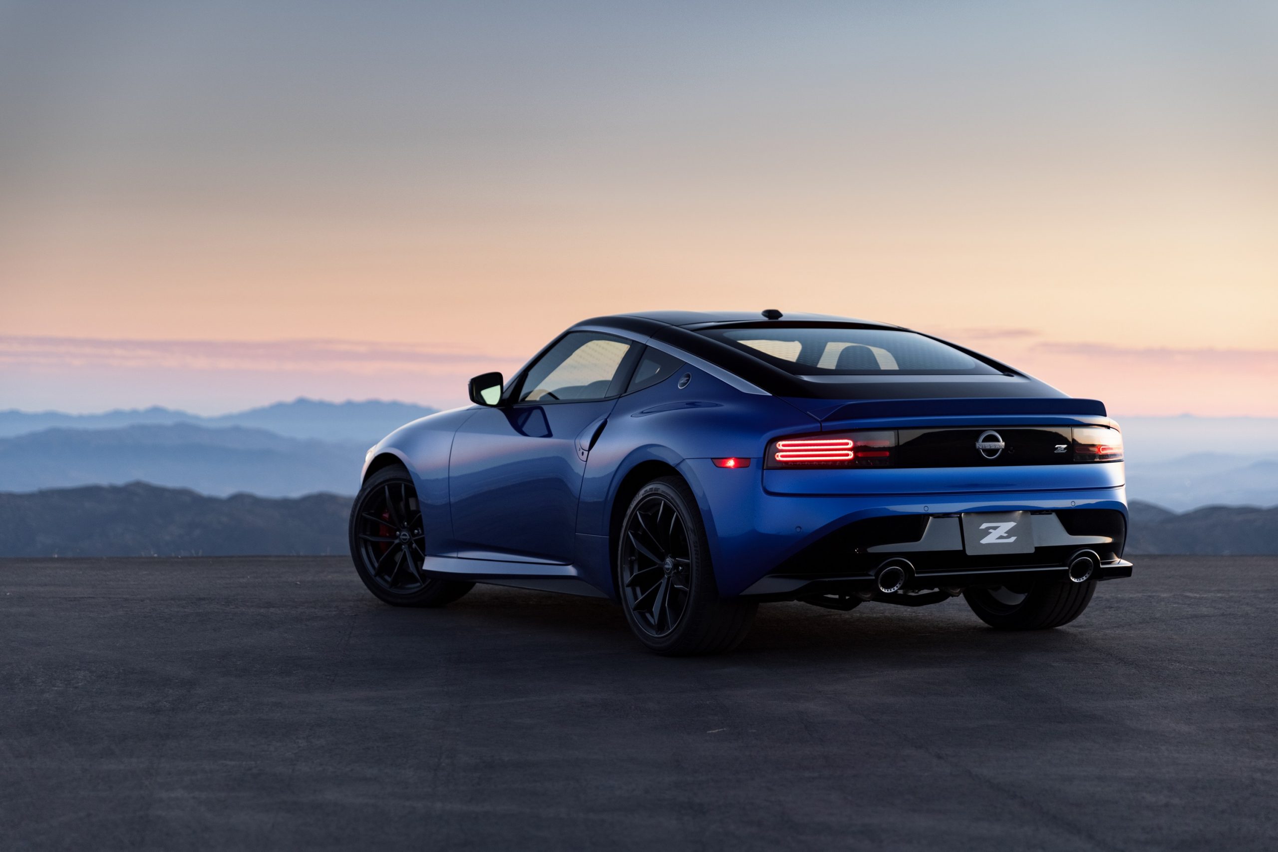 A rear 3/4 shot of the new Nissan Z Car at sunset in the Angeles Forest