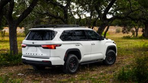 A white 2023 Toyota Sequoia in the woods.