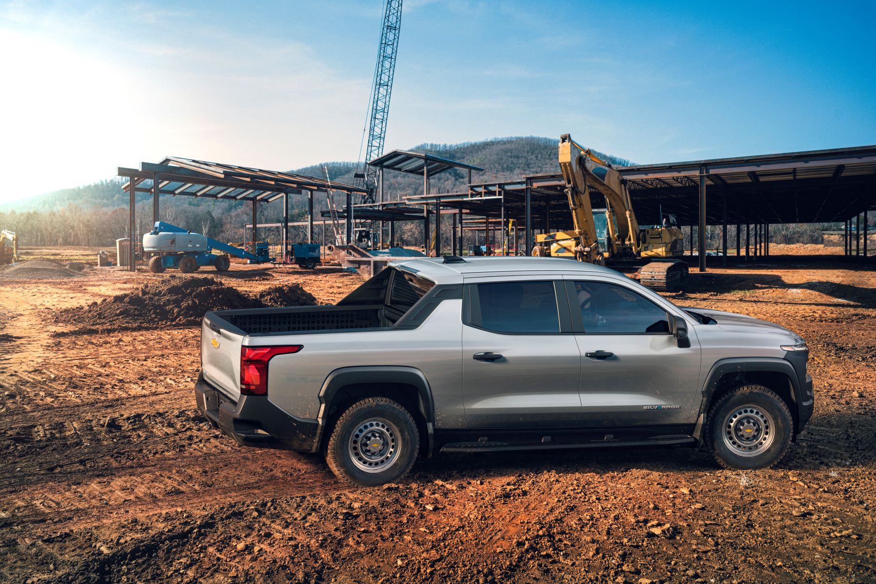 The 2024 Chevy Silverado WT (Work Truck) electric (EV) pickup truck model parked at a construction site