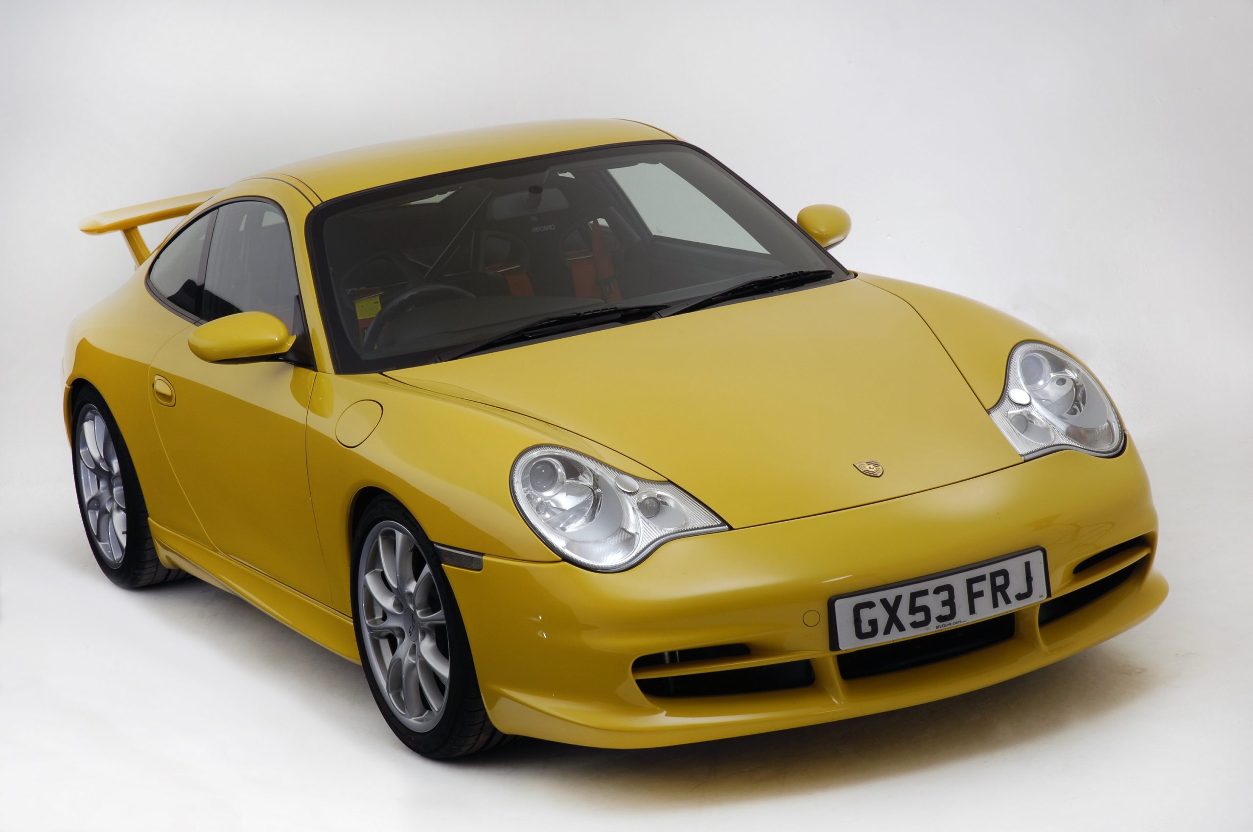 A yellow 996 Porsche 911 GT3 shot from the front 3/4