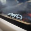 The AWD badge on a Subaru sedan