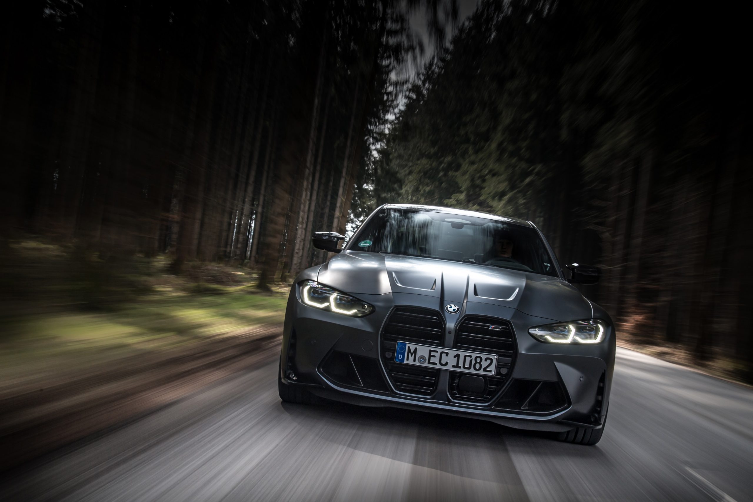 A grey BMW M3, one of the worst car trends offenders with a big grille