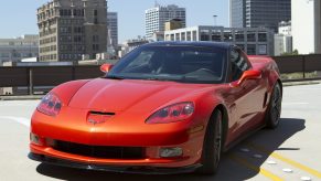 An orange C6 Chevrolet Corvette shot from the front 3/4