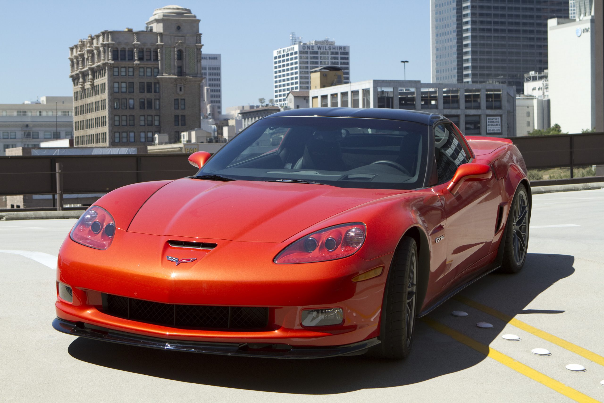 An orange C6 Chevrolet Corvette shot from the front 3/4