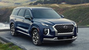 A black 2022 Hyundai Palisade Calligraphy parked outside.