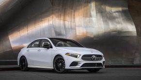 A 3/4 front view of a Mercedes-Benz A220 sedan in white