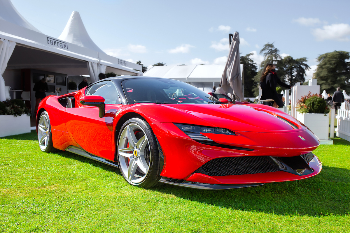 A red Ferrari SF90 Stradale at Salon Prive in the United Kingdom's Concours d'Elegance