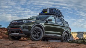 A black 2022 Ford Expedition Timberline full-size SUV is parked off-road.