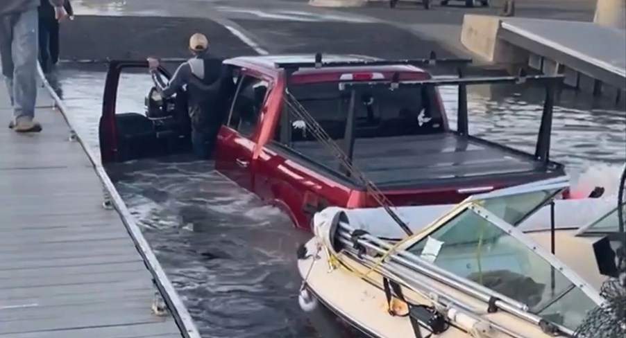 Ford F-150 attempting to launch a boat from the boat ramp.