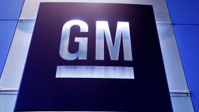 A silver and blue general motors (GM) logo.