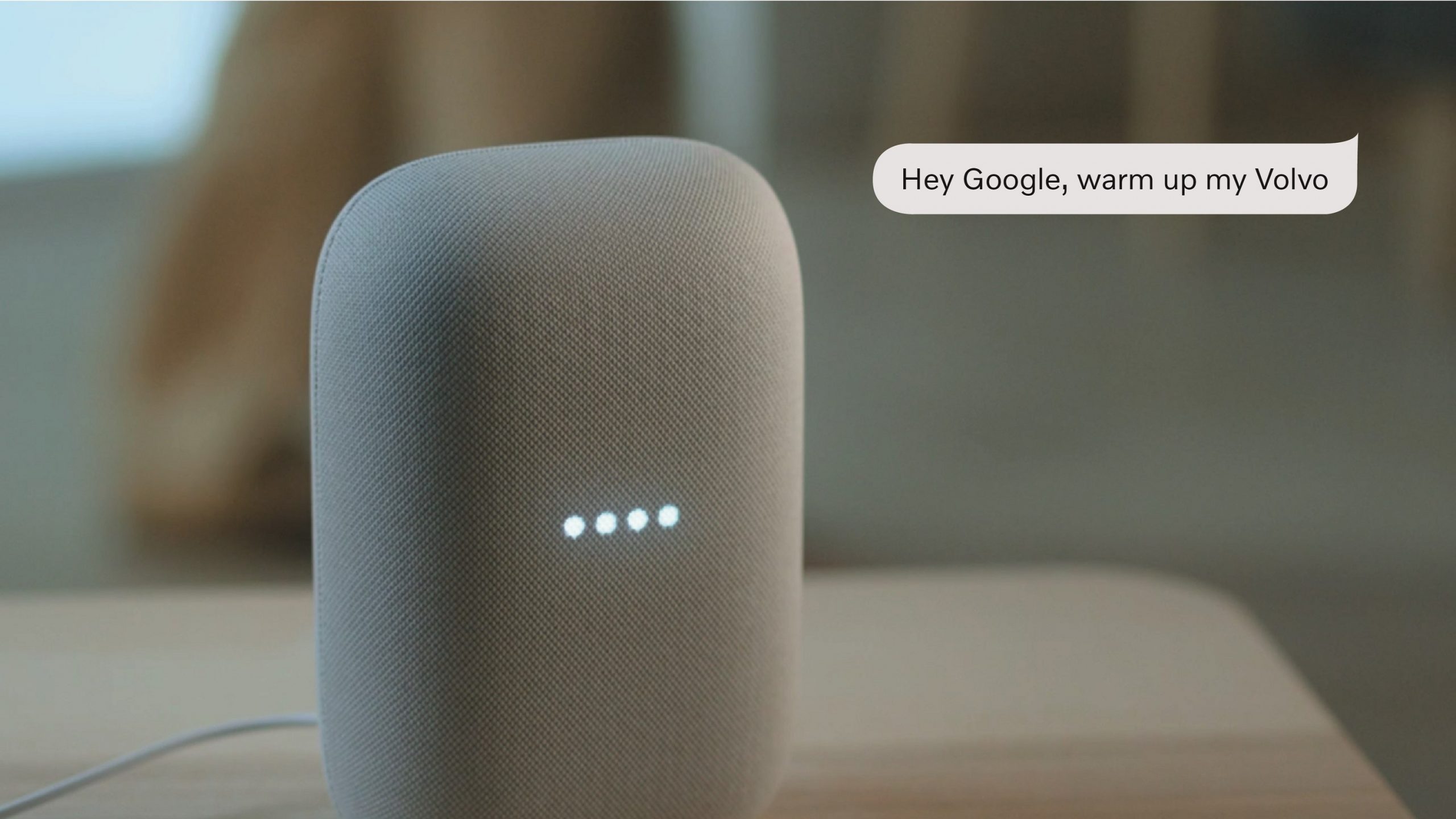 A Google Home device pictured on an end table in a home