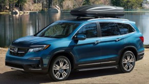 A blue 2022 Honda Pilot Elite midsize SUV.