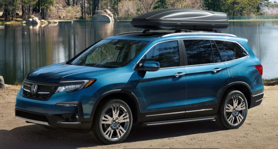 A blue 2022 Honda Pilot Elite midsize SUV.