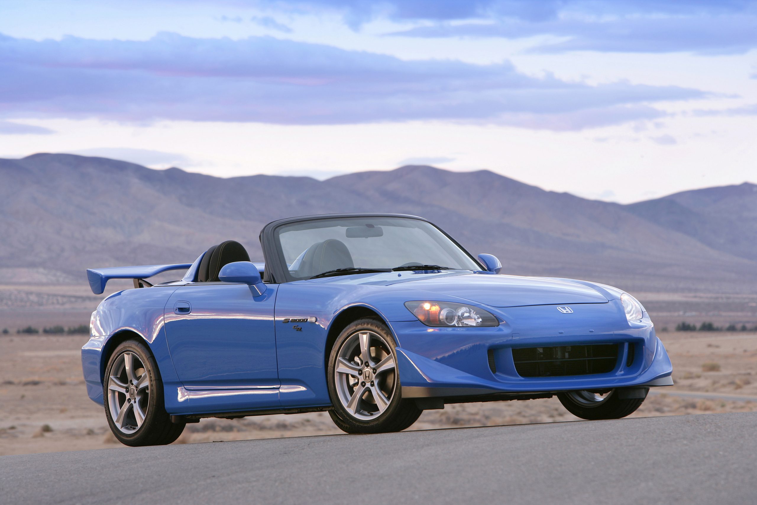 A blue AP2 CR shot from the front 3/4 at Willow Springs Raceway