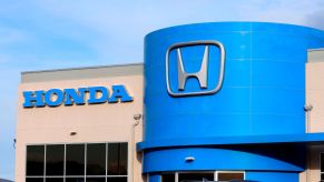 Honda dealership, where the 2022 Honda Passport Trailsport is sold, with the blue section and Honda logo on the building.