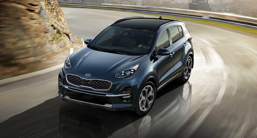 A blue 2022 Kia Sportage is turning.