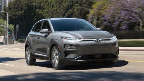 A gray 2021 Hyundai Kona Electric parked in a parking lot.