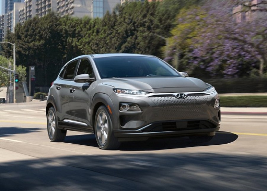 A gray 2021 Hyundai Kona Electric parked in a parking lot.