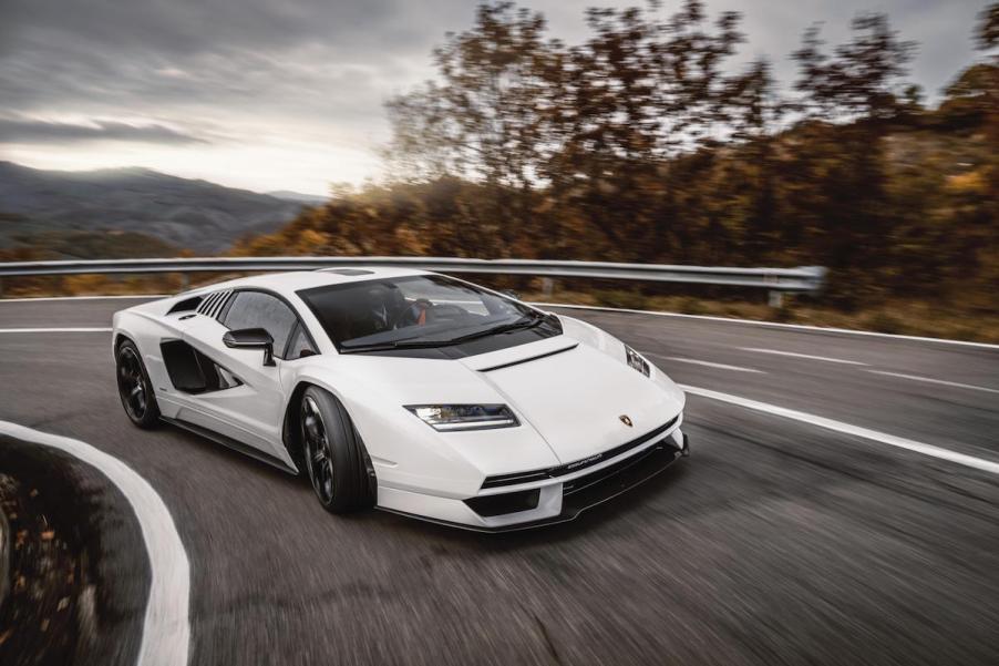 A white Lamborghini Countach LPI 800-4 corners on a mountain road