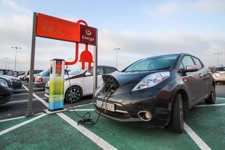 Nissan Leaf EV being charged at an electric vehicle charging station in Gdansk, Poland