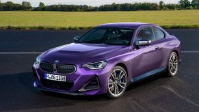 A 3/4 front view of a Thundernight Purple 2022 BMW 2 Series Coupe