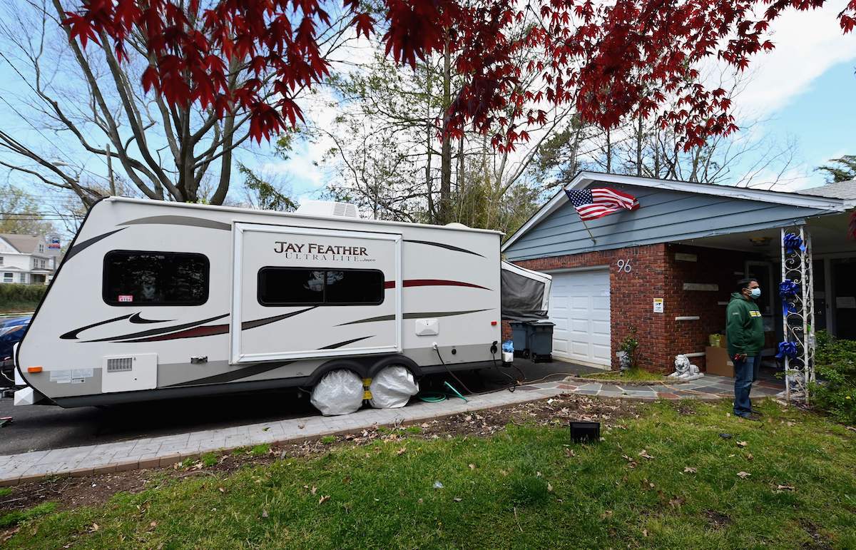 An RV parked in the driveway of a home in Nutley, New Jersey