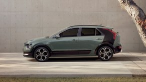 Side view of Cityscape Green 2023 Kia Niro