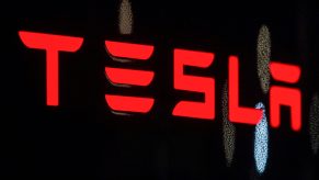 Tesla written out in red on a black background