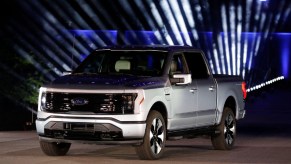 A gray Ford F-150 Lightning is on display.