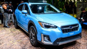 A blue Subaru Crosstrek is on display.