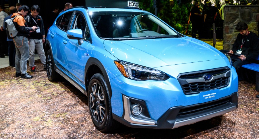 A blue Subaru Crosstrek is on display.