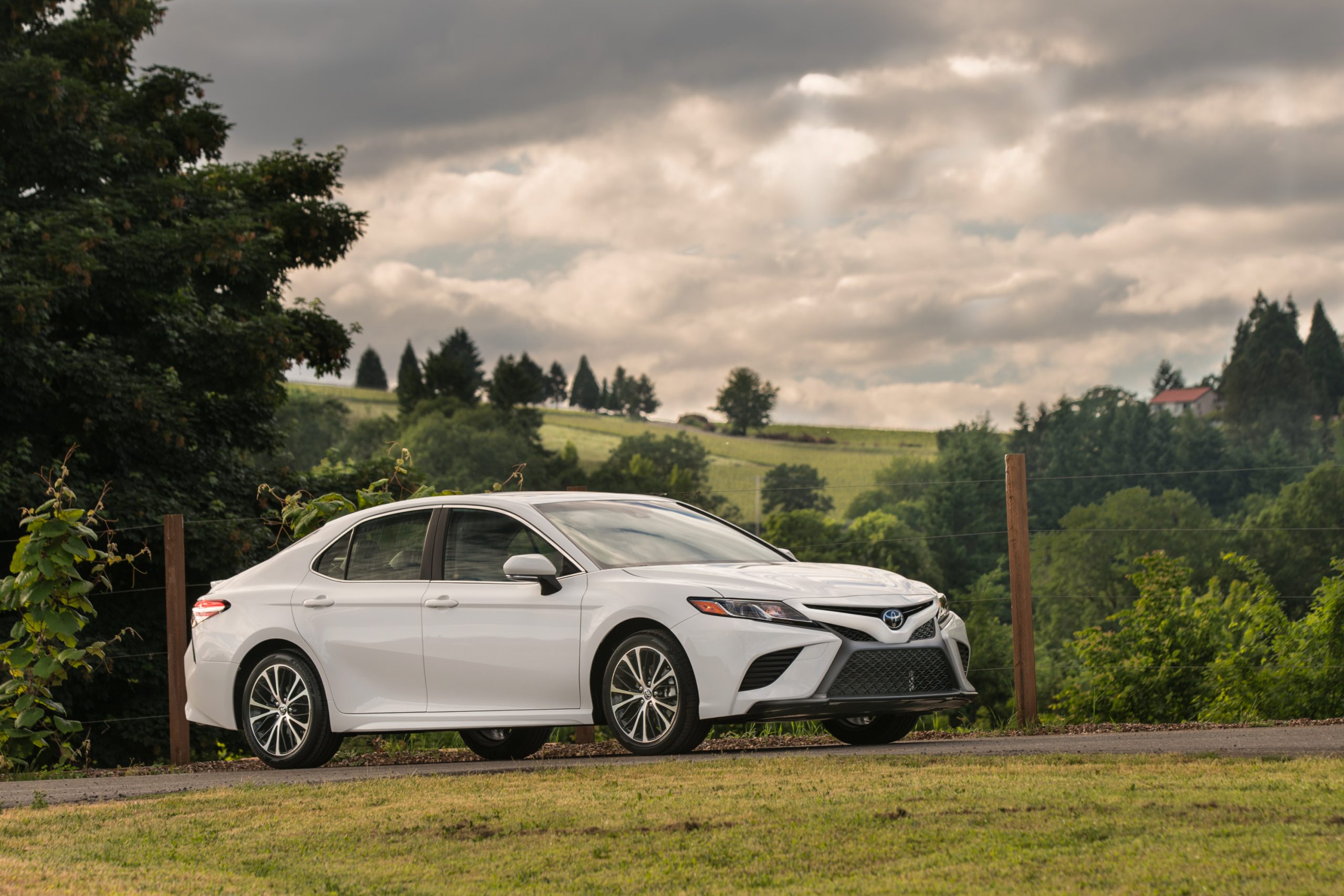 A white Toyota Camry shot from the front 3/4