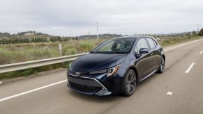 A dark blue Toyota Corolla hatchback shot from the front 3/4