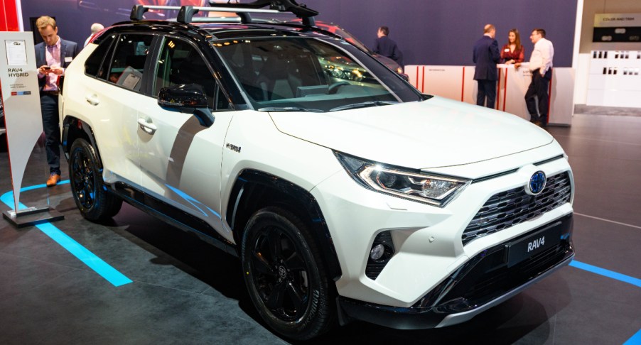 A white 2022 Toyota RAV4 Hybrid is on display.