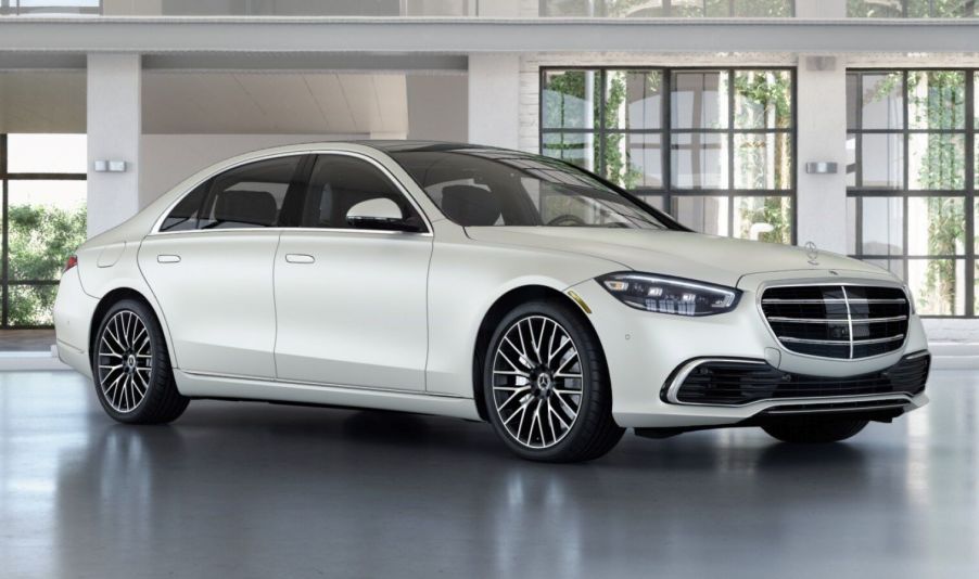 White fully loaded new 2022 Mercedes-Benz S-Class S 580 4MATIC Executive Line parked near a house