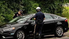 Highway Patrol police officers pulling over a car in Nassau County, New York