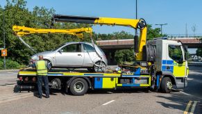 Police repossessing and securing a car in London, United Kingdom (U.K.)