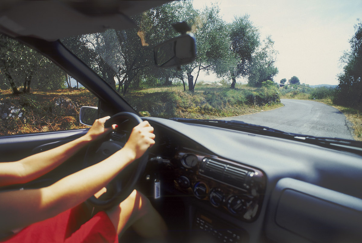 Hands on a steering wheel while driving in Ibiza, Spain, in 2004